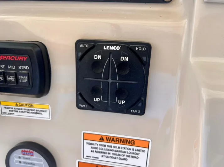 Sea SeÑor Yacht Photos Pics Control panel on a 2017 Boston Whaler 370 Outrage boat with Lenco trim tab switches.