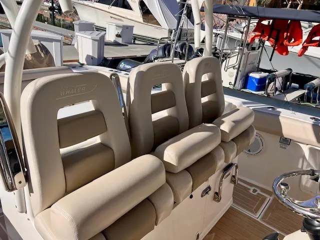 Sea SeÑor Yacht Photos Pics 2017 Boston Whaler 370 Outrage boat interior with beige seating and helm station.