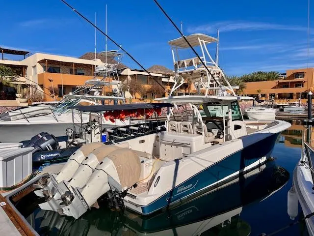 Sea SeÑor Yacht Photos Pics Boston Whaler 370 Outrage 2017 docked in marina, featuring triple outboard engines.