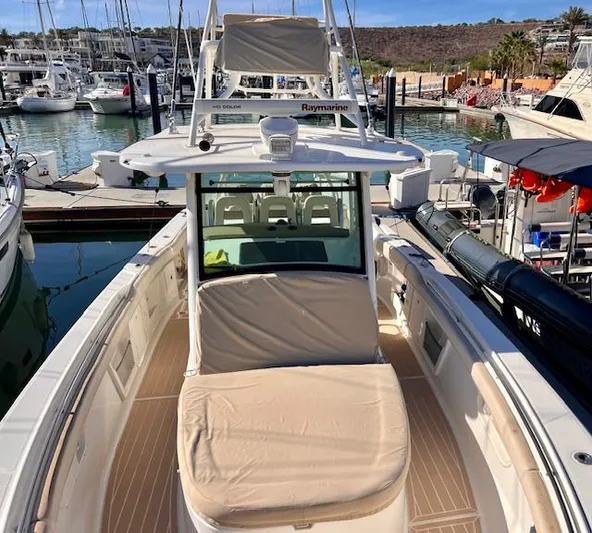 Sea SeÑor Yacht Photos Pics 2017 Boston Whaler 370 Outrage docked at marina, featuring spacious deck and seating.
