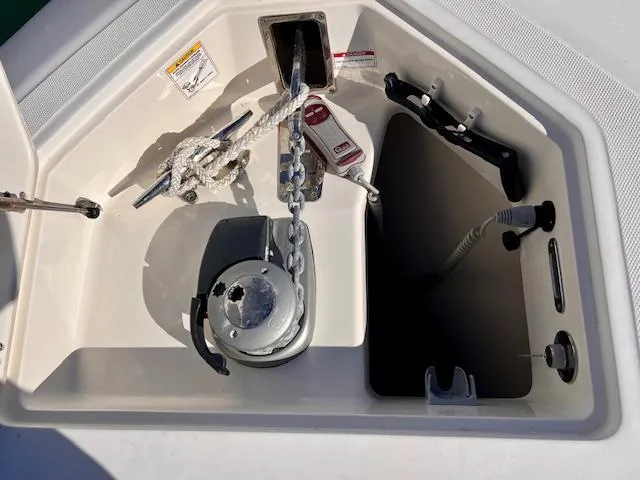 Sea SeÑor Yacht Photos Pics 2017 Boston Whaler 370 Outrage anchor compartment with winch and rope details.