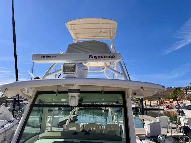 Sea SeÑor Yacht Photos Pics 2017 Boston Whaler 370 Outrage with Raymarine equipment, docked in a marina under clear skies.
