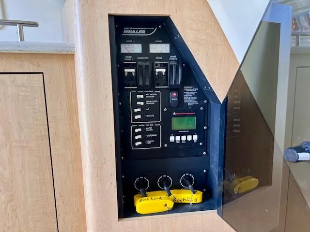 Sea SeÑor Yacht Photos Pics Control panel of a 2017 Boston Whaler 370 Outrage boat with switches and keys.