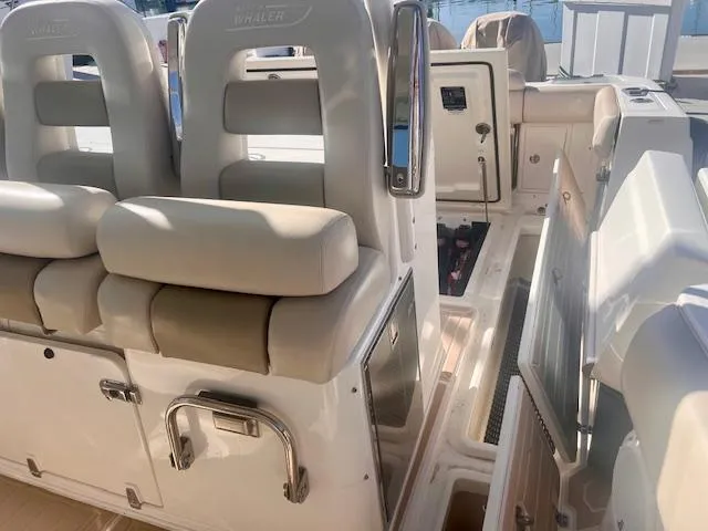 Sea SeÑor Yacht Photos Pics 2017 Boston Whaler 370 Outrage interior with cushioned seating and storage compartments.
