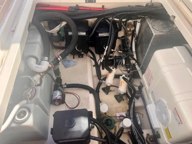 Sea SeÑor Yacht Photos Pics Engine compartment of a 2017 Boston Whaler 370 Outrage, showcasing wiring and components.