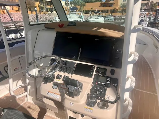 Sea SeÑor Yacht Photos Pics 2017 Boston Whaler 370 Outrage helm with advanced navigation and control systems.