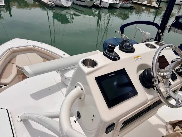 Sea SeÑor Yacht Photos Pics 2017 Boston Whaler 370 Outrage helm with navigation system, docked in marina.
