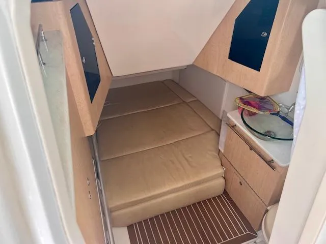 Sea SeÑor Yacht Photos Pics 2017 Boston Whaler 370 Outrage cabin interior with bed and sink.