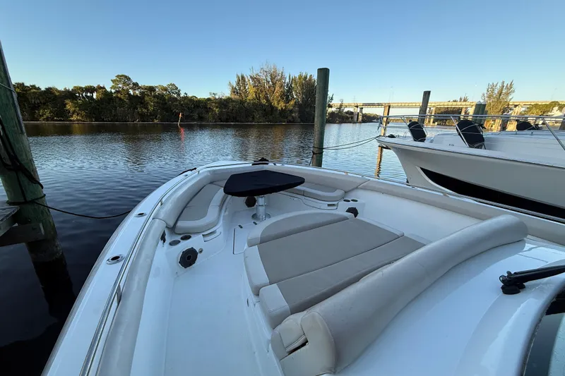  Yacht Photos Pics 2020 Boston Whaler 420 Outrage docked, featuring spacious seating and scenic waterfront view.