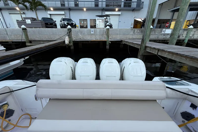  Yacht Photos Pics 2020 Boston Whaler 420 Outrage with four Mercury outboard engines at a marina dock.