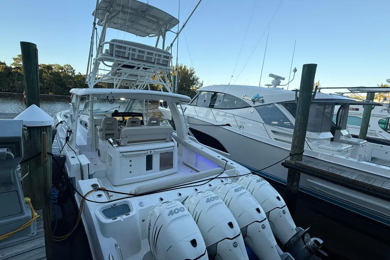  Yacht Photos Pics 2020 Boston Whaler 420 Outrage docked with multiple outboard engines.