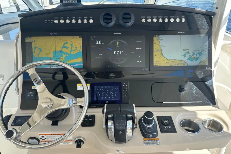 Yacht Photos Pics 2020 Boston Whaler 420 Outrage helm with advanced navigation displays and controls.