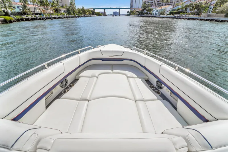 Without A Kaire Yacht Photos Pics 2020 Formula 310 Bowrider boat with spacious seating on a scenic waterway.