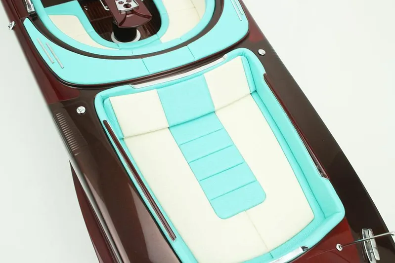 Anniversario No. 7 Of 18 Yacht Photos Pics 2024 Riva Anniversario boat with turquoise and cream seating, elegant design.