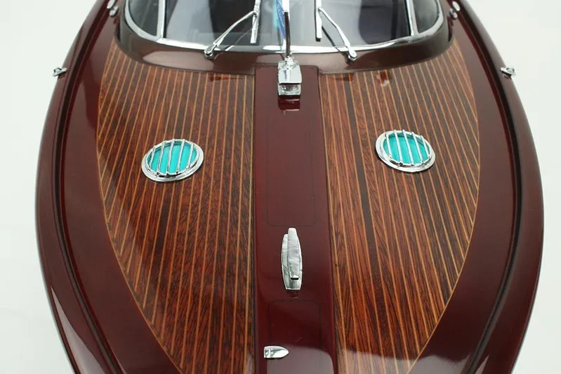 Anniversario No. 7 Of 18 Yacht Photos Pics 2024 Riva Anniversario boat with elegant wooden deck and chrome accents.