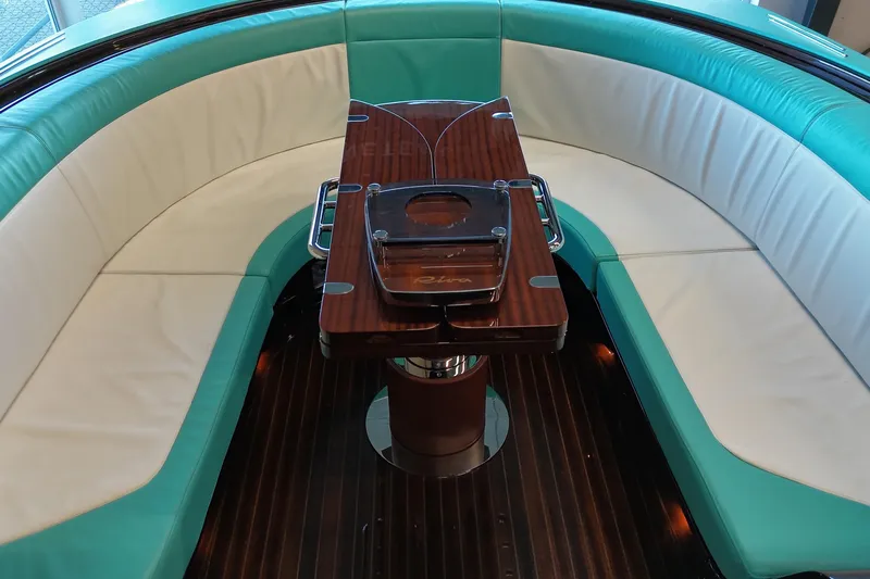 Anniversario No. 7 Of 18 Yacht Photos Pics Luxurious seating area on 2024 Riva Anniversario yacht with elegant wood table.