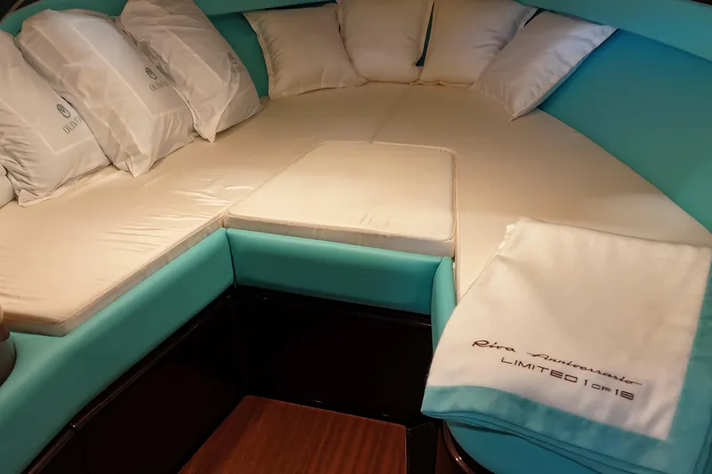 Anniversario No. 7 Of 18 Yacht Photos Pics Luxurious interior of 2024 Riva Anniversario yacht, featuring elegant bedding and limited edition detailing.