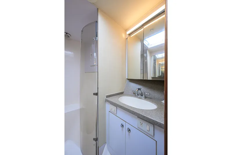 Members Only Yacht Photos Pics Bathroom interior of 2001 Ocean Yachts Super Sport with sink and shower.