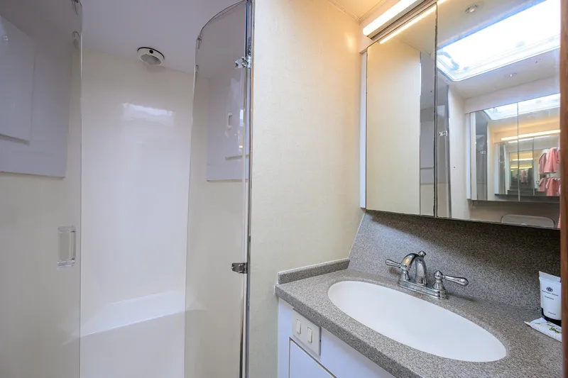 Members Only Yacht Photos Pics Bathroom interior of 2001 Ocean Yachts Super Sport with shower and sink.