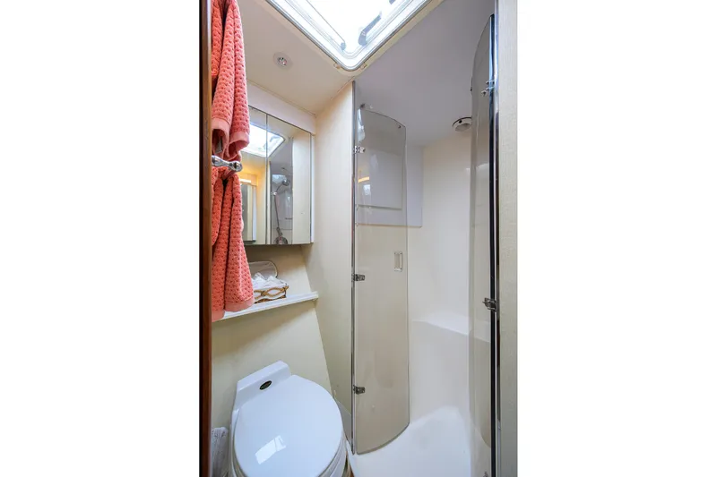 Members Only Yacht Photos Pics Bathroom interior of 2001 Ocean Yachts Super Sport with shower and toilet.