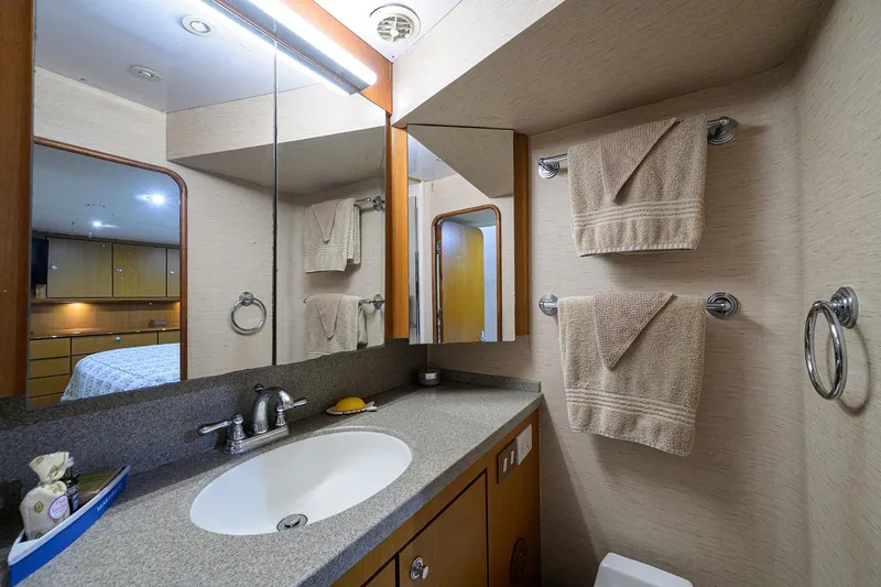 Members Only Yacht Photos Pics Luxurious bathroom in 2001 Ocean Yachts Super Sport, featuring modern fixtures and elegant design.