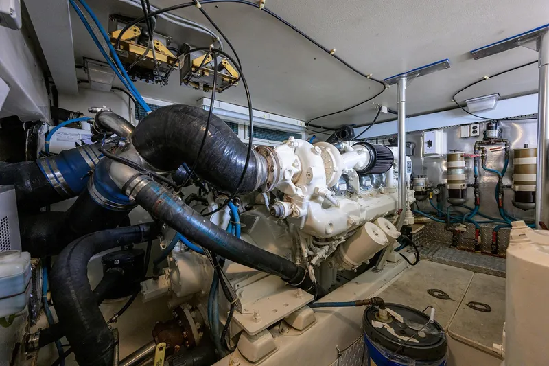 Members Only Yacht Photos Pics Engine room of a 2001 Ocean Yachts Super Sport boat, showcasing complex machinery.