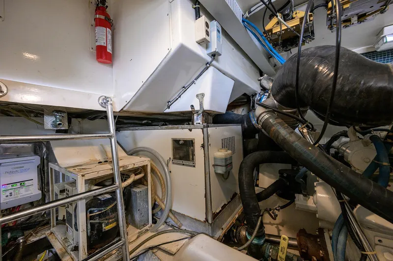 Members Only Yacht Photos Pics Engine room of a 2001 Ocean Yachts Super Sport with visible machinery and equipment.