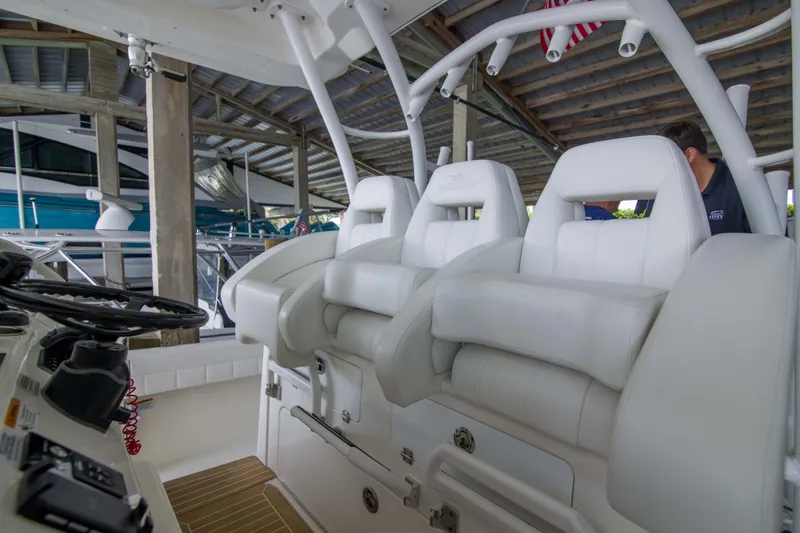 Miss Megan Yacht Photos Pics 2021 Regulator 41 boat interior with white seating and steering console.