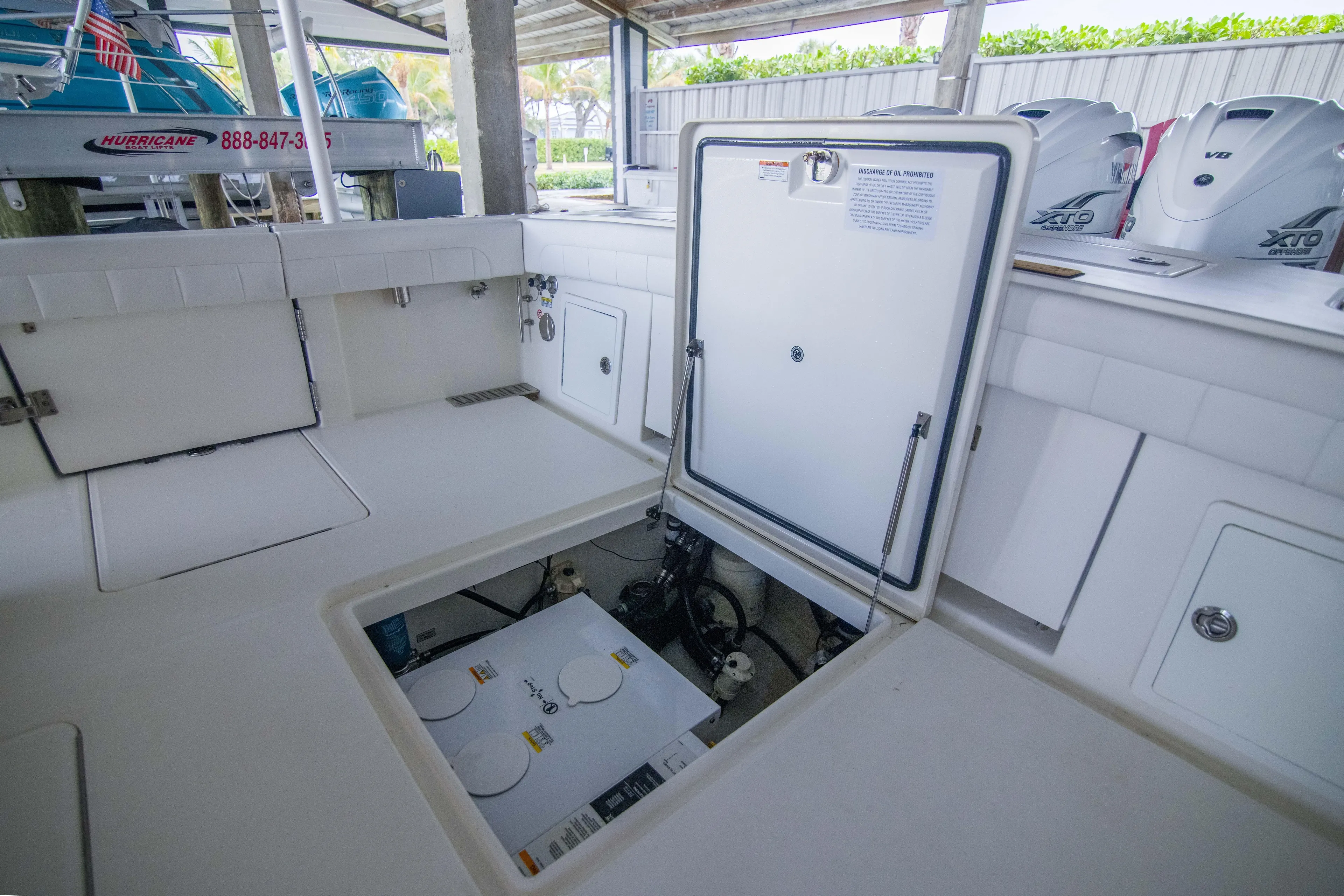 Miss Megan Yacht Photos Pics 2021 Regulator 41 boat interior with open hatch and visible engine components.