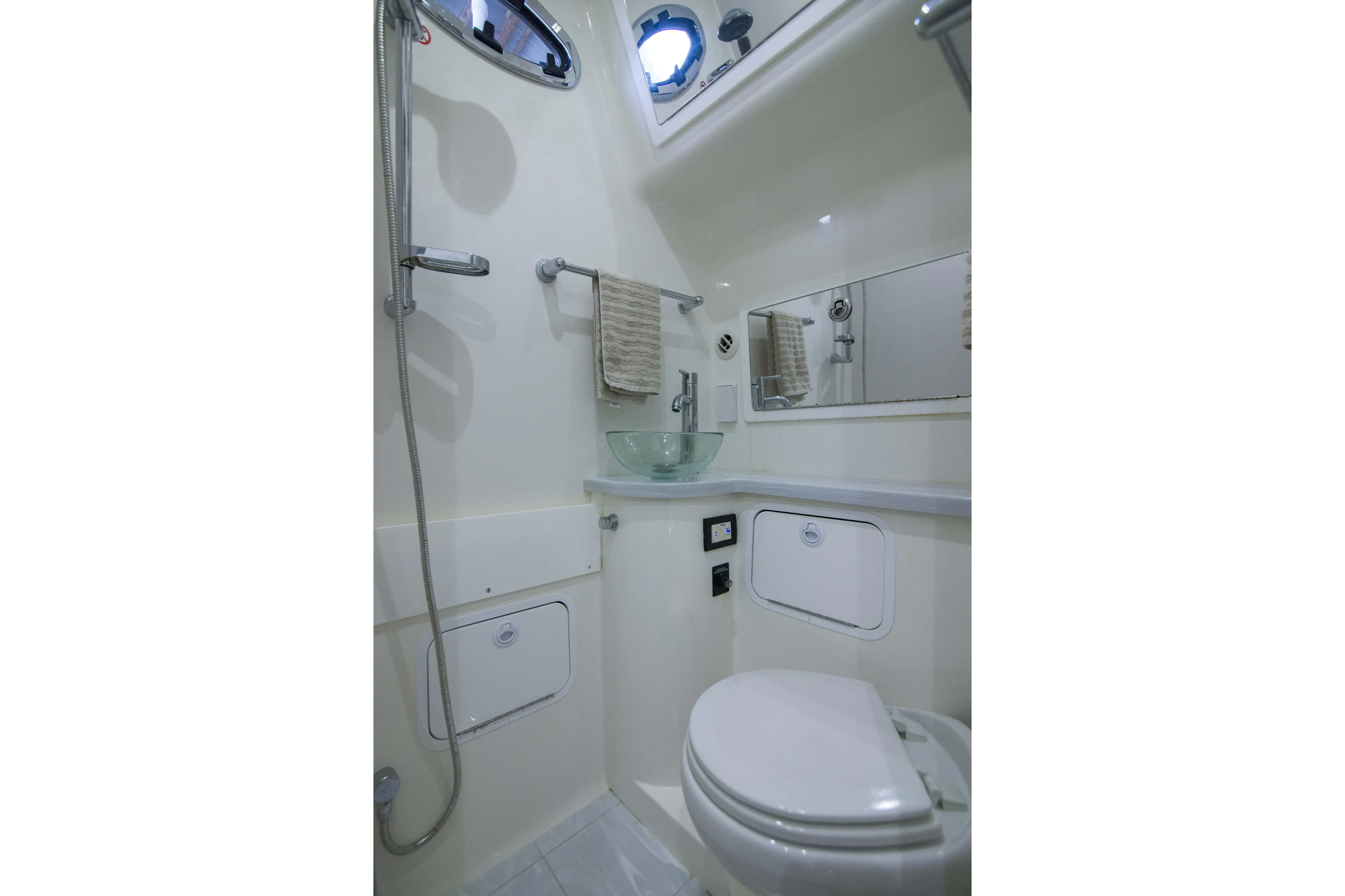 Miss Megan Yacht Photos Pics 2021 Regulator 41 boat bathroom with shower, sink, and toilet.
