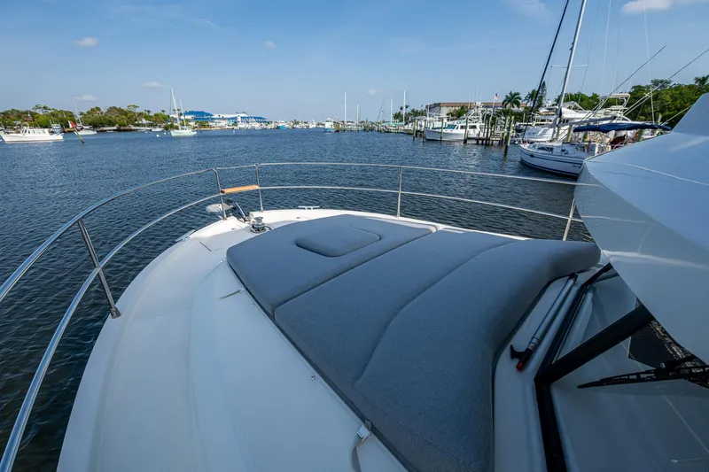 Ashokan Yacht Photos Pics 2022 Beneteau Swift Trawler 35 on calm waters, featuring spacious deck and scenic marina view.