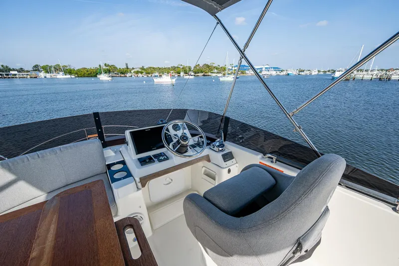 Ashokan Yacht Photos Pics 2022 Beneteau Swift Trawler 35 helm with scenic water view.