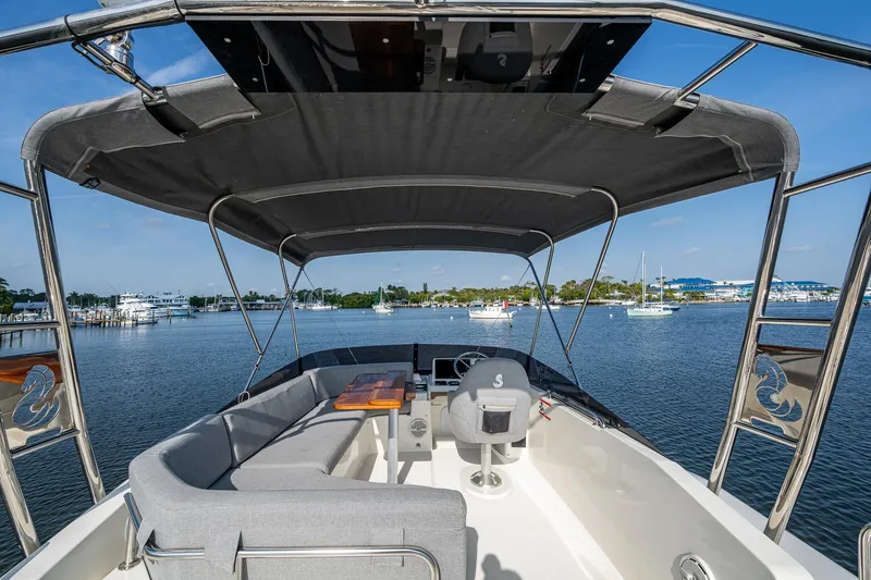 Ashokan Yacht Photos Pics Flybridge view of 2022 Beneteau Swift Trawler 35, featuring seating and canopy.