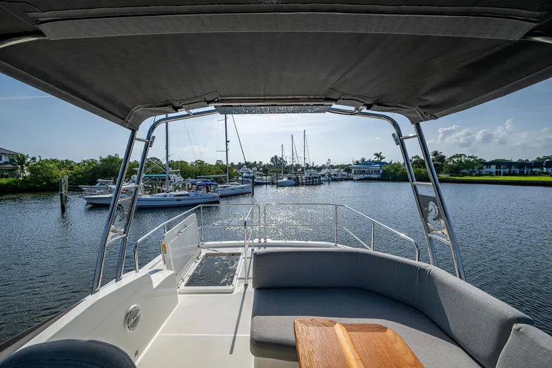 Ashokan Yacht Photos Pics 2022 Beneteau Swift Trawler 35, view from deck overlooking marina and waterway.