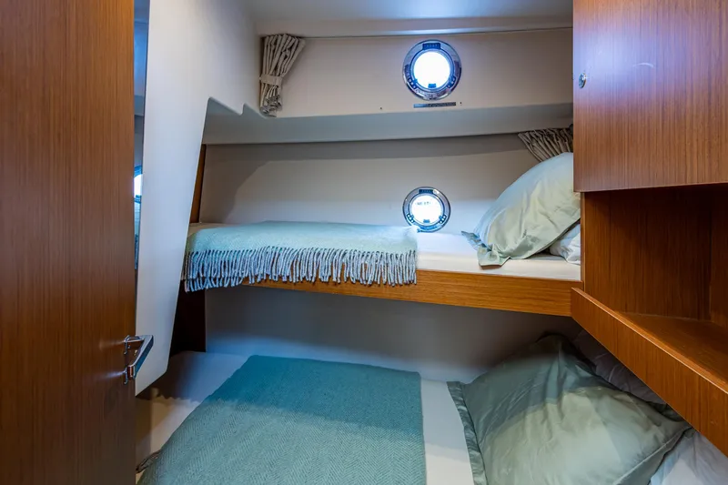 Ashokan Yacht Photos Pics 2022 Beneteau Swift Trawler 35 cabin with bunk beds and portholes.