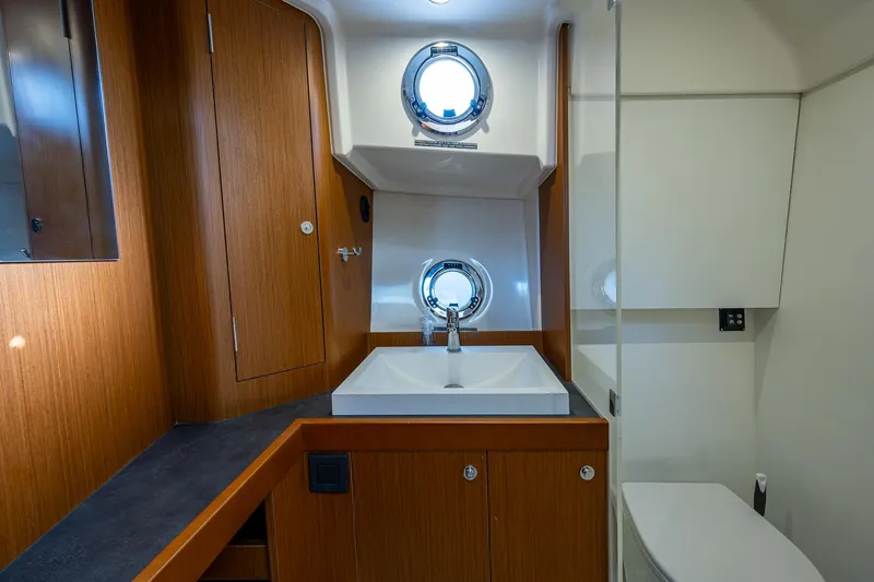 Ashokan Yacht Photos Pics 2022 Beneteau Swift Trawler 35 bathroom with wood cabinetry and modern fixtures.
