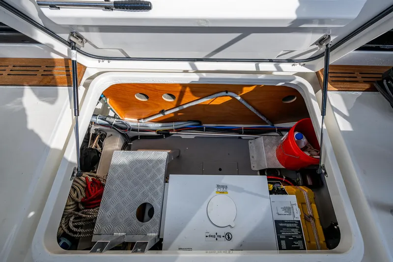 Ashokan Yacht Photos Pics 2022 Beneteau Swift Trawler 35 storage compartment with equipment and tools.