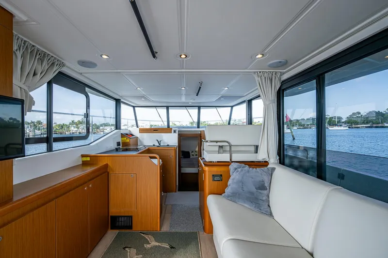 Ashokan Yacht Photos Pics Interior of 2022 Beneteau Swift Trawler 35 with modern furnishings and panoramic windows.