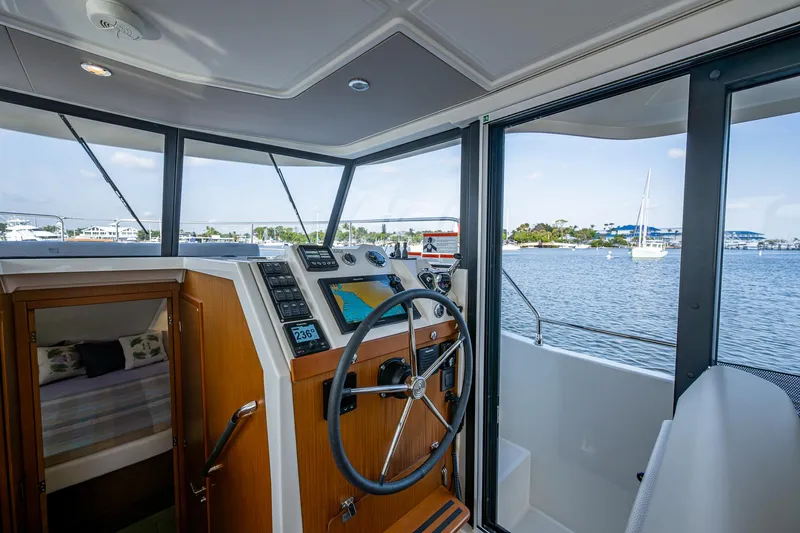 Ashokan Yacht Photos Pics Interior helm of 2022 Beneteau Swift Trawler 35 with scenic water view.