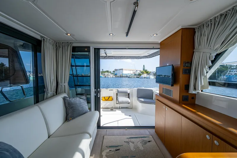 Ashokan Yacht Photos Pics Interior of 2022 Beneteau Swift Trawler 35 with waterfront view through sliding doors.