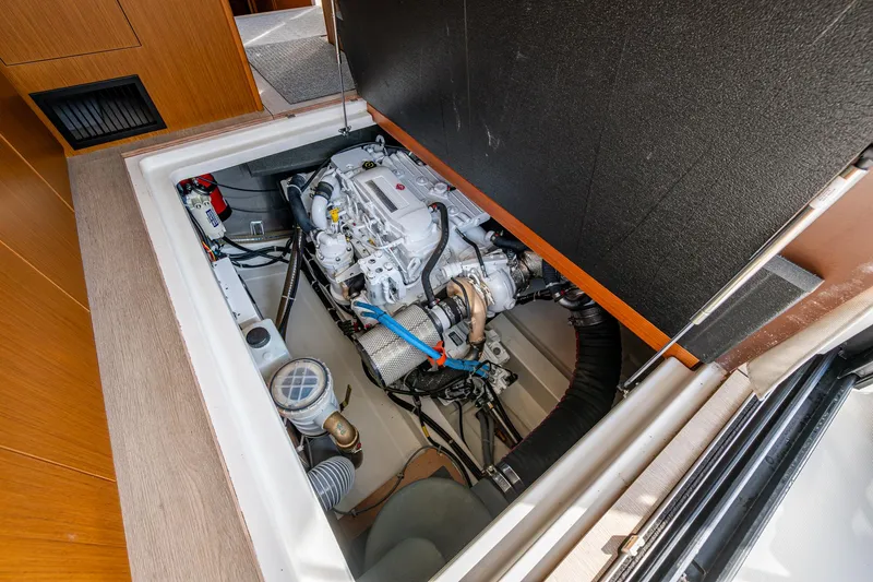 Ashokan Yacht Photos Pics Engine compartment of 2022 Beneteau Swift Trawler 35, showcasing mechanical components and layout.