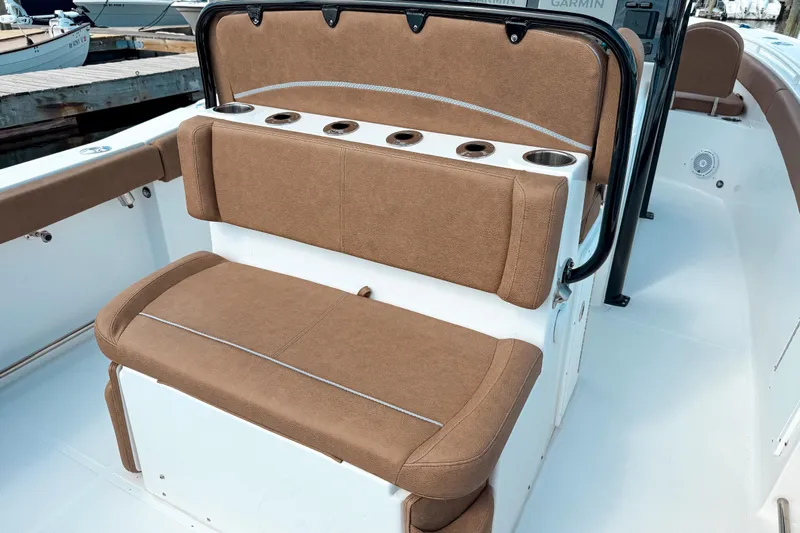  Yacht Photos Pics 2023 Sea Hunt Ultra 275 SE boat seating with cup holders, docked at marina.