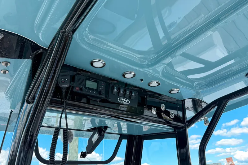  Yacht Photos Pics 2023 Sea Hunt Ultra 275 SE boat console with electronics and sleek design.