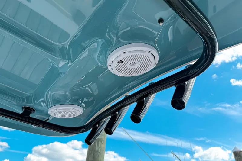  Yacht Photos Pics 2023 Sea Hunt Ultra 275 SE boat speakers and rod holders against blue sky.