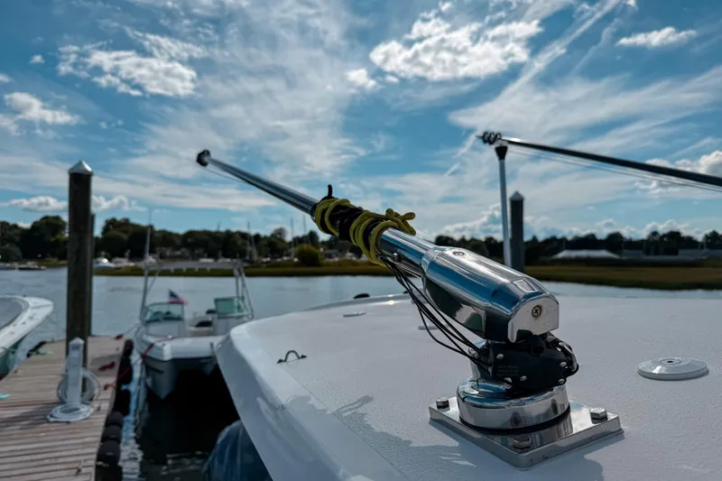  Yacht Photos Pics 2023 Sea Hunt Ultra 275 SE boat docked under a vibrant blue sky.