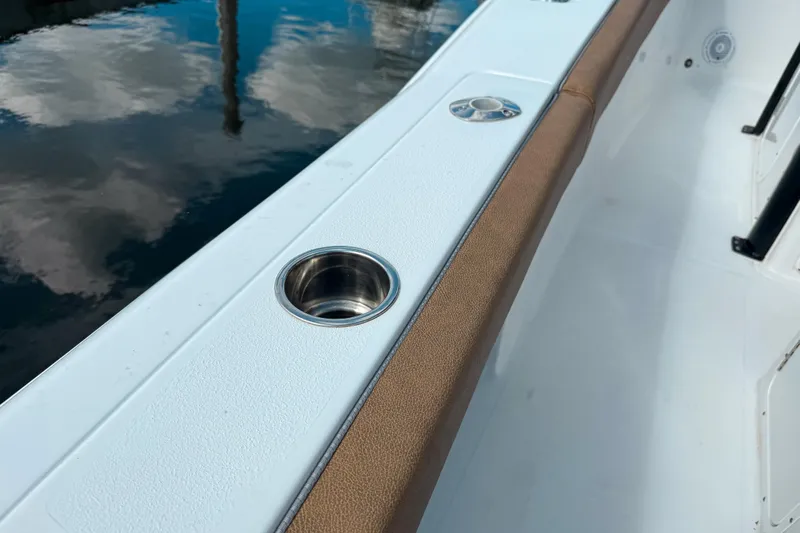  Yacht Photos Pics 2023 Sea Hunt Ultra 275 SE boat interior with cup holder and cushioned seating.