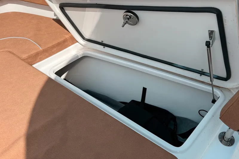  Yacht Photos Pics Storage compartment on 2023 Sea Hunt Ultra 275 SE boat with open lid.