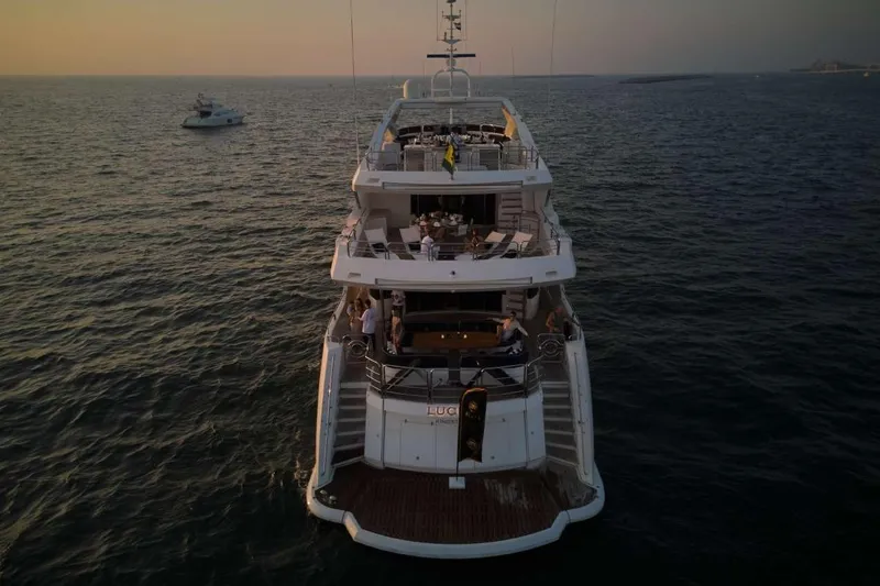  Yacht Photos Pics Luxurious 2010 Sunseeker 131 Yacht on open sea at sunset.