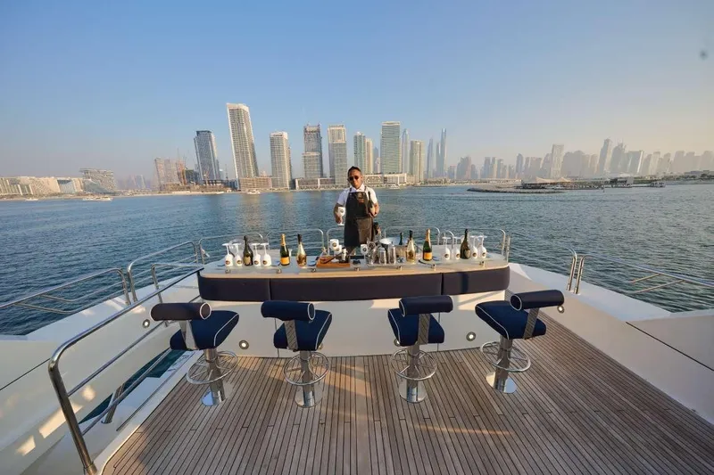  Yacht Photos Pics Luxurious Sunseeker 131 Yacht with bar setup, city skyline in background, 2010 model.