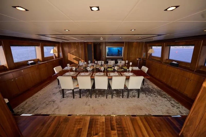  Yacht Photos Pics Luxurious dining area on a 2010 Sunseeker 131 Yacht, featuring elegant table settings and panoramic windows.